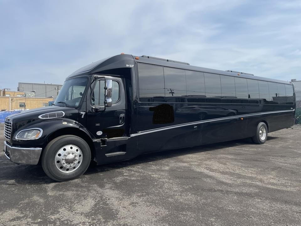 Rent Freightliner Black Party Bus from Prom Pink Limo